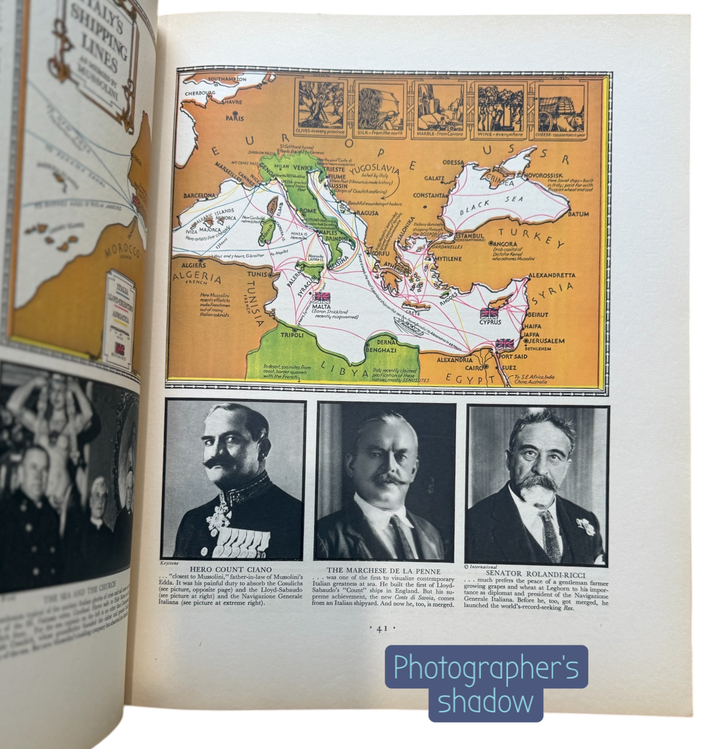 Open book with historical content including a map and black-and-white photos of men.