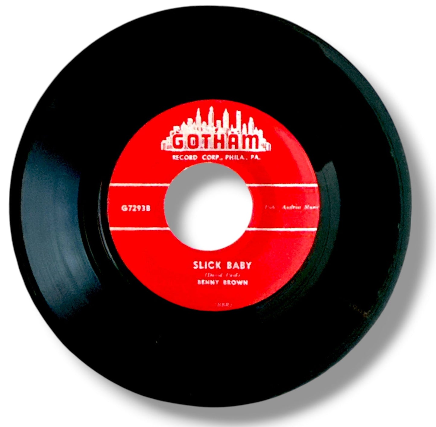 Black vinyl record with a red label featuring 'Gotham Record Corp' on a white background