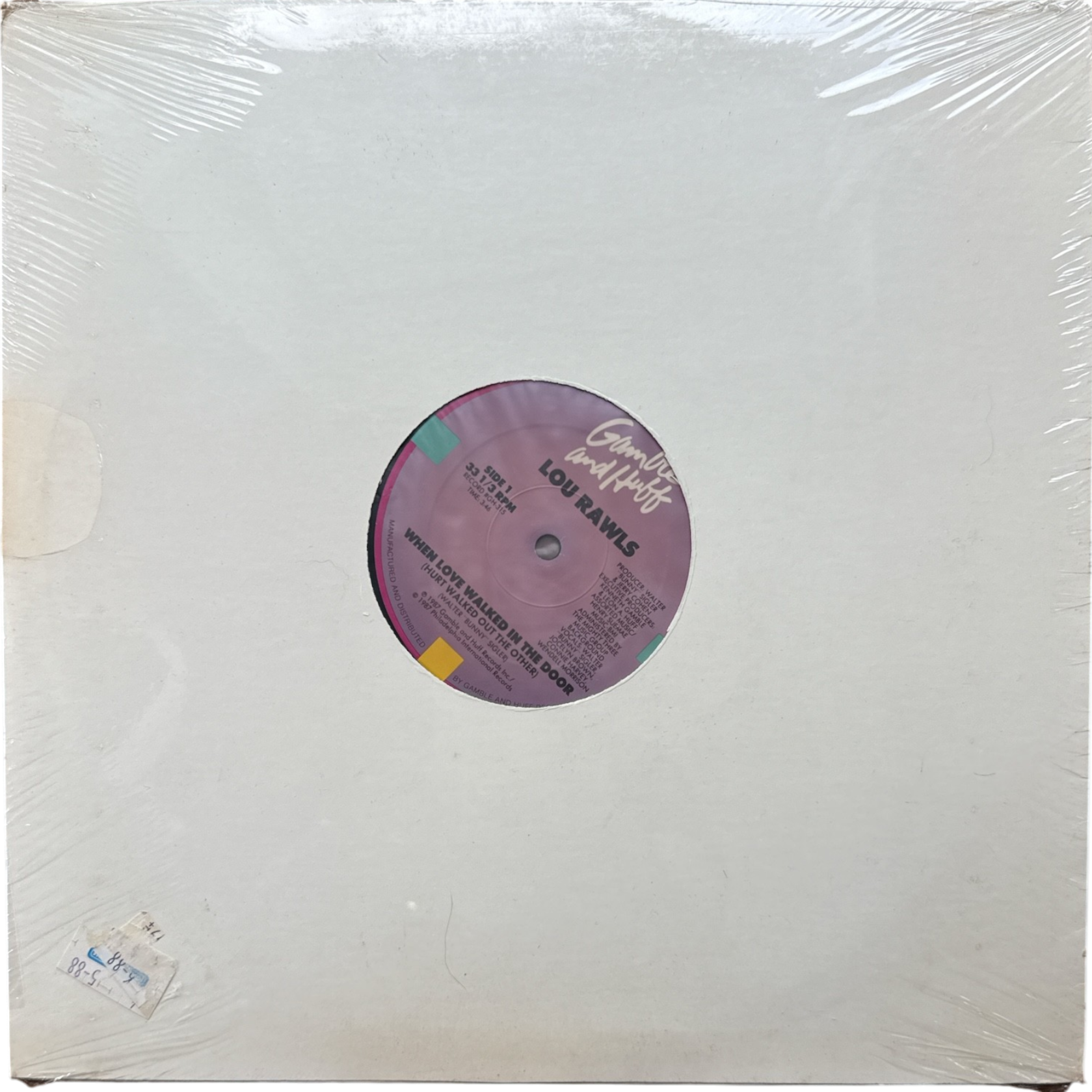 Vinyl record in a clear plastic sleeve with a purple label.